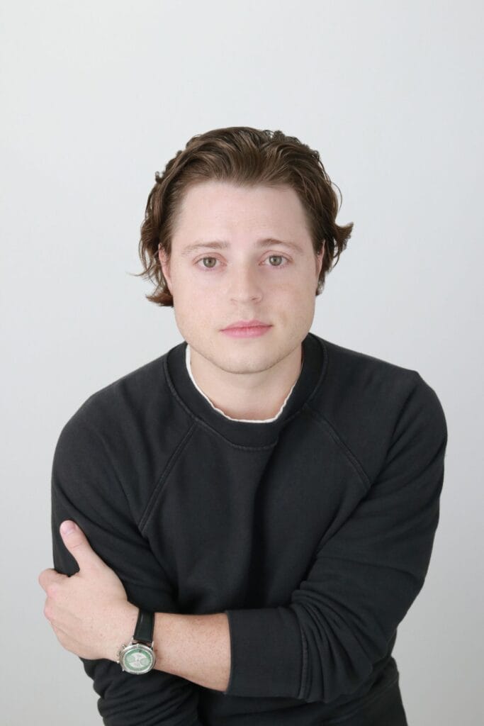 Portrait of Andy Sommer in a black crewneck sweater.